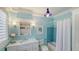 Charming bathroom with blue walls, classic fixtures, and a bright, airy feel at 7715 Westmoreland Dr, Sarasota, FL 34243