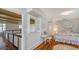Upstairs landing with a view into the bedroom, including a desk, chair, and queen size bed at 7715 Westmoreland Dr, Sarasota, FL 34243