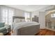 Bright and airy bedroom with hardwood floors, comfortable furnishings, and a serene atmosphere at 7715 Westmoreland Dr, Sarasota, FL 34243