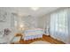 Bright bedroom with hardwood floors, modern decor, and plenty of natural light at 7715 Westmoreland Dr, Sarasota, FL 34243