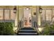 Front entrance view from the doorway with lights, flowers, and a piano at 7715 Westmoreland Dr, Sarasota, FL 34243