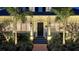 Beautiful front entrance with palm trees, landscaping, and updated stairs at 7715 Westmoreland Dr, Sarasota, FL 34243