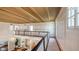 Bright, spacious hallway with a view overlooking the elegant living room below at 7715 Westmoreland Dr, Sarasota, FL 34243