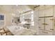 Gourmet kitchen features marble counters, custom cabinets with glass accents, and a vintage-inspired refrigerator at 7715 Westmoreland Dr, Sarasota, FL 34243