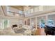Elegant living room featuring a fireplace, comfortable seating, and large windows at 7715 Westmoreland Dr, Sarasota, FL 34243