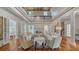Open concept living room with high ceilings, hardwood floors, and French doors at 7715 Westmoreland Dr, Sarasota, FL 34243