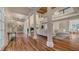Spacious living room with high ceilings, large windows, and gleaming hardwood floors at 7715 Westmoreland Dr, Sarasota, FL 34243