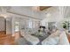 Elegant living room featuring soaring ceilings, crystal chandeliers, and beautiful hardwood floors at 7715 Westmoreland Dr, Sarasota, FL 34243