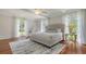 Spacious bedroom filled with natural light and features a comfortable bed and stylish décor at 7715 Westmoreland Dr, Sarasota, FL 34243