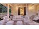 Relaxing outdoor patio features elegant white furniture, creating a serene and inviting space at 7715 Westmoreland Dr, Sarasota, FL 34243