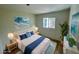 Bedroom is bright and features a large window, wood floors and is tastefully decorated at 8219 Drew St, Englewood, FL 34224