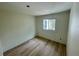 Bedroom boasts wood floors, a window offering natural light, and ample space at 8219 Drew St, Englewood, FL 34224