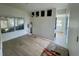 Bright living room with wood flooring and view to sunroom at 8219 Drew St, Englewood, FL 34224