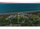 Aerial view of a vacant lot outlined in white, with beach proximity and luxury homes at 8270 Manasota Key Rd, Englewood, FL 34223