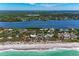 Aerial view of a vacant lot outlined in white, near the beach and intercoastal waterway at 8270 Manasota Key Rd, Englewood, FL 34223