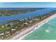 Beautiful aerial view of waterfront property with pristine beach access and serene landscape at 8270 Manasota Key Rd, Englewood, FL 34223