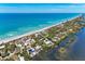 Gorgeous aerial shot of a beachside property with stunning ocean and bay views at 8270 Manasota Key Rd, Englewood, FL 34223