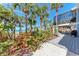 Beautiful beachfront home featuring a spacious deck, lush landscaping, and ocean views at 8270 Manasota Key Rd, Englewood, FL 34223