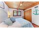 Bedroom with wood ceilings, tile floors, and a closet at 8270 Manasota Key Rd, Englewood, FL 34223