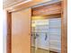 Open walk-in closet with shelving and hangers under a wood paneled ceiling at 8270 Manasota Key Rd, Englewood, FL 34223