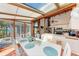 Sunroom dining area open to the kitchen, and with views of the sea at 8270 Manasota Key Rd, Englewood, FL 34223