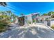 Beautiful exterior featuring lush landscaping and a charming beach home at 8270 Manasota Key Rd, Englewood, FL 34223