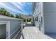 Expansive deck showcasing a walkway to the house and outdoor space for entertaining at 8270 Manasota Key Rd, Englewood, FL 34223