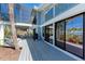Spacious deck area perfect for entertaining with ocean views and lush tropical surroundings at 8270 Manasota Key Rd, Englewood, FL 34223