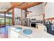 Well-lit kitchen featuring an island, stainless steel appliances, and high wood-beamed ceilings at 8270 Manasota Key Rd, Englewood, FL 34223