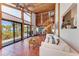 Spacious living room with high ceilings, water view, and a unique spiral staircase at 8270 Manasota Key Rd, Englewood, FL 34223