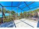 Expansive screened patio with tile flooring offers stunning ocean views and plenty of sunshine at 8270 Manasota Key Rd, Englewood, FL 34223