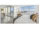 Bright bedroom with large windows, water view, and a private balcony showcasing city and water views at 888 Blvd Of The Arts # 1402, Sarasota, FL 34236