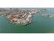 Wide aerial of real estate showcasing island community, waterways, and residential properties, from overhead at 902 Gibbs Rd # 282, Venice, FL 34285