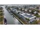 Aerial view of condo along canal with boat docks, offering waterside living and marina access at 902 Gibbs Rd # 282, Venice, FL 34285