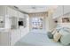 Bright bedroom with a view to the outside, white cabinets and drawers for storage, and a ceiling fan at 902 Gibbs Rd # 282, Venice, FL 34285
