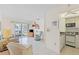 Comfortable living space featuring a partial view of the kitchen, enhancing the open-concept design at 902 Gibbs Rd # 282, Venice, FL 34285