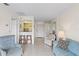Comfortable living room with views into the kitchen and a large cabinet for storage at 902 Gibbs Rd # 282, Venice, FL 34285