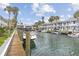 Beautiful waterfront homes with boat docks and lush tropical landscaping along a canal at 902 Gibbs Rd # 282, Venice, FL 34285