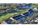 Beautiful aerial view of condo community with golf course and lush landscaping, offering a serene setting at 9570 High Gate Dr # 1722, Sarasota, FL 34238