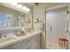 Elegant bathroom with a double vanity, stylish mirror, and a glass-enclosed shower at 9570 High Gate Dr # 1722, Sarasota, FL 34238