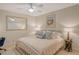 Comfortable bedroom with ceiling fan, inviting bed, and a calming, neutral color palette at 9570 High Gate Dr # 1722, Sarasota, FL 34238