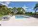 Inviting community pool with ample lounge chairs for relaxing in a well-maintained setting at 9570 High Gate Dr # 1722, Sarasota, FL 34238