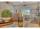 Dining table setting with a decorative centerpiece, offering a glimpse of the balcony at 9570 High Gate Dr # 1722, Sarasota, FL 34238