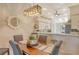 Cozy dining area featuring modern lighting and views into the kitchen at 9570 High Gate Dr # 1722, Sarasota, FL 34238