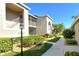 Charming condo exterior featuring well-maintained landscaping, creating an inviting curb appeal at 9570 High Gate Dr # 1722, Sarasota, FL 34238