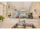 Kitchen view showcasing the sink and faucet with an open view to the living room beyond at 9570 High Gate Dr # 1722, Sarasota, FL 34238