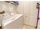 Functional laundry area with a washer, dryer, and convenient storage options at 9570 High Gate Dr # 1722, Sarasota, FL 34238