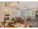 Spacious open-plan living area with vaulted ceilings and bar area offering a seamless flow at 9570 High Gate Dr # 1722, Sarasota, FL 34238