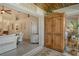 Open-concept living space with an armoire, leading into the sunroom at 9570 High Gate Dr # 1722, Sarasota, FL 34238