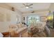 Comfortable living room with neutral decor, plush seating, and expansive windows that flood the room with light at 9570 High Gate Dr # 1722, Sarasota, FL 34238